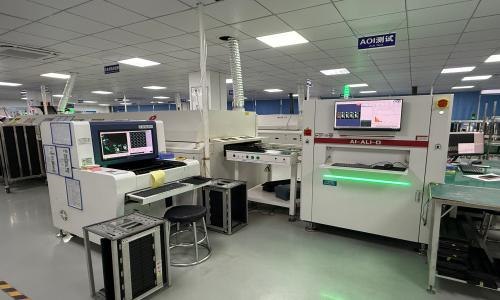 Automated optical inspection equipment checking completed PCB assemblies